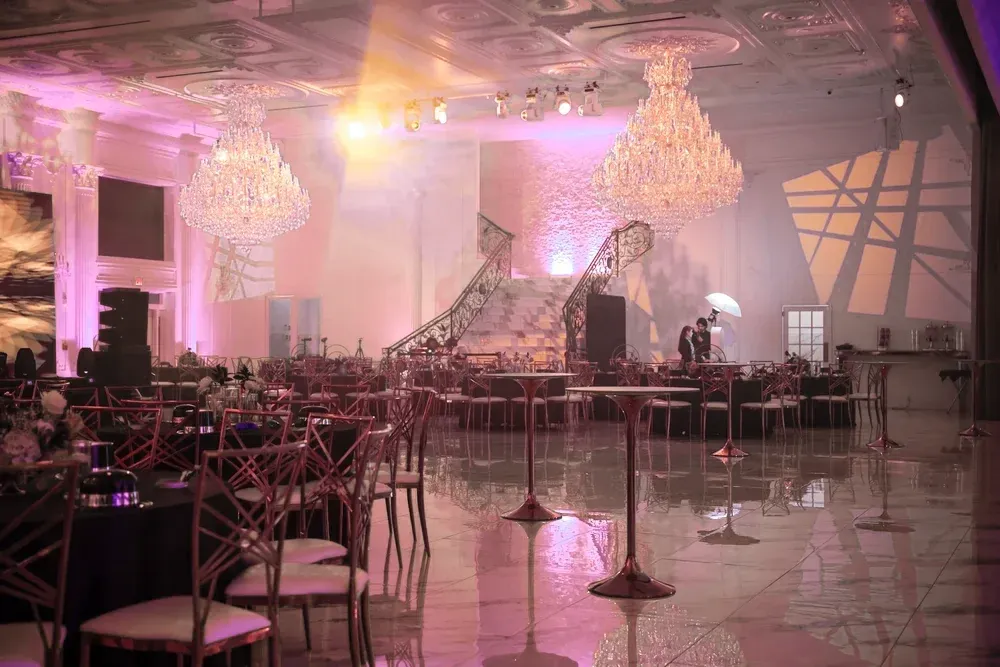 Crystal chandeliers and string-lit tables set for a private event at Whites Ferry Manor